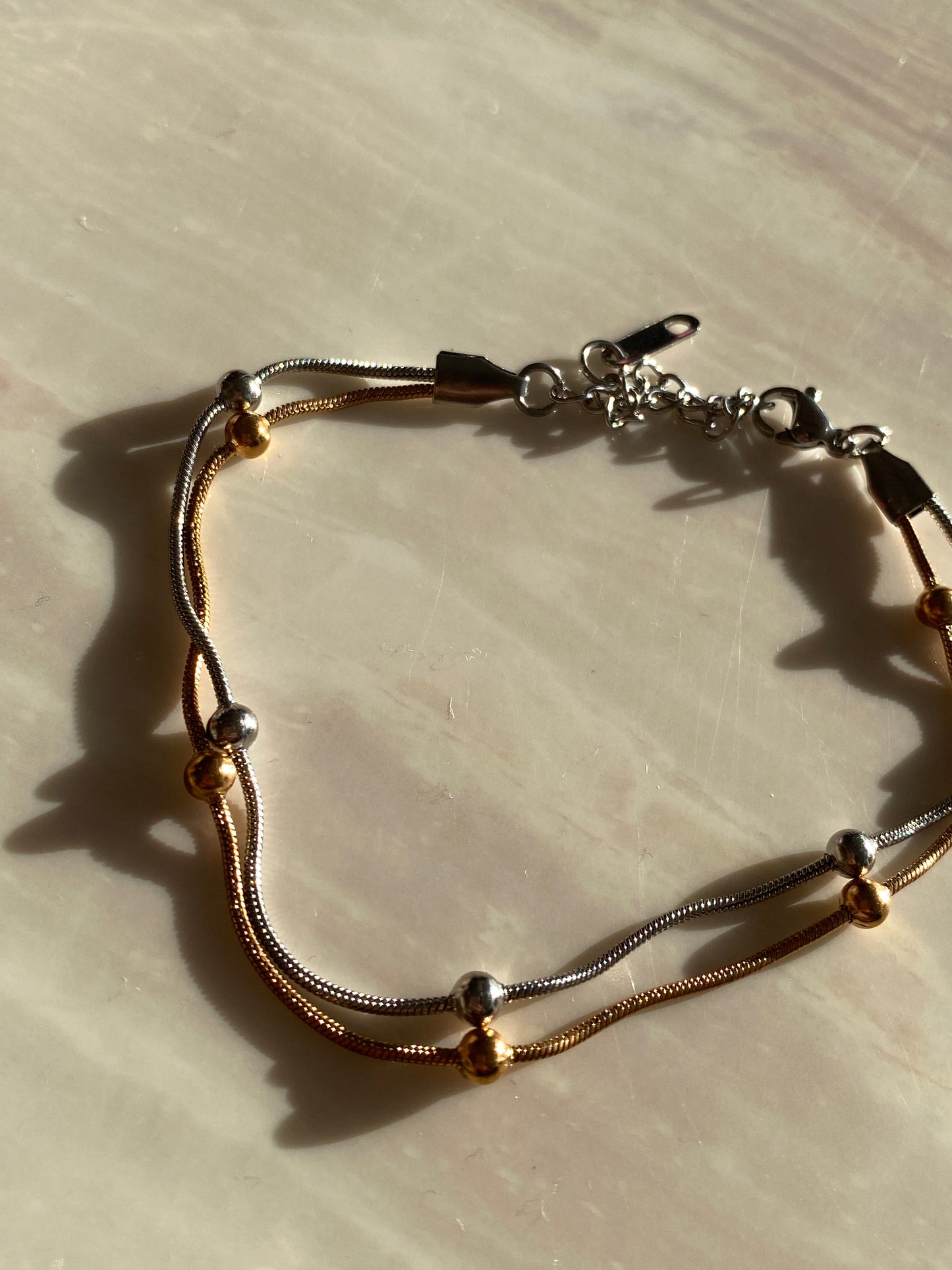 PULSERA PLATEADA Y COBRE ACERO INOXIDABLE