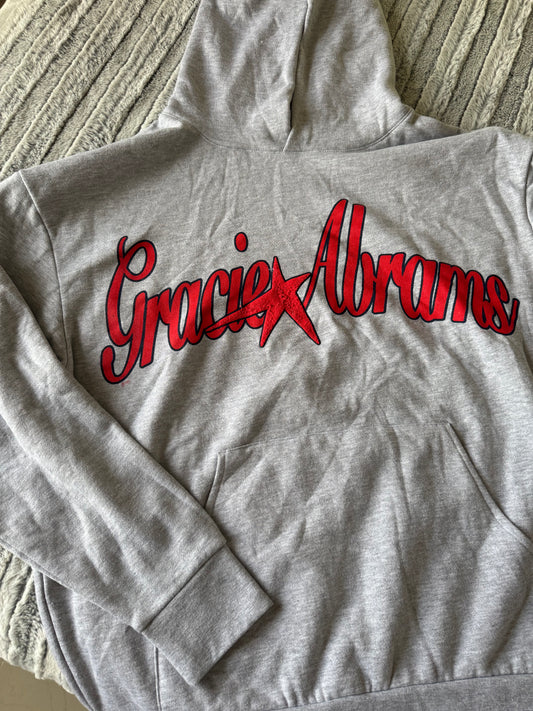 PIEZA DAÑADA -TSOU Deluxe Heather Grey Star Hoodie - LIGERA TEXTURA EN LA ESTRELLA Y MANCHA PEQUEÑA